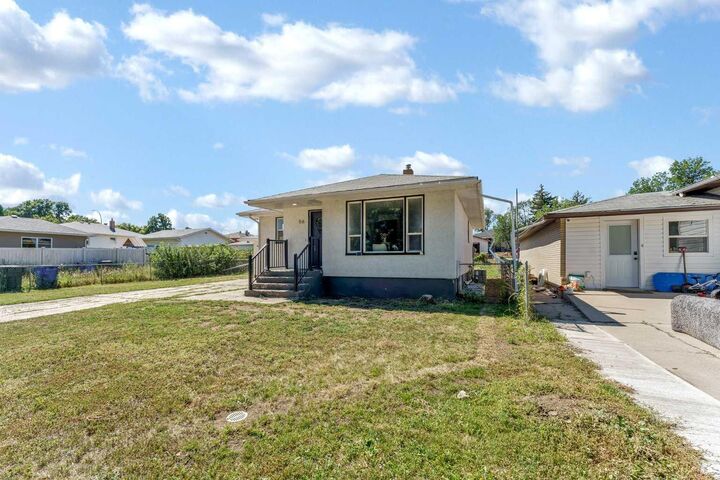 Property Photo:  56 Robertson Way SW  AB T1A 5J2 