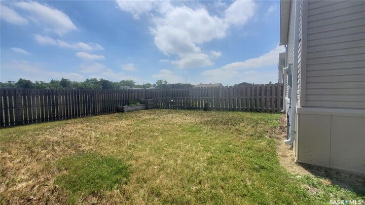 Property Photo:  210 Brownlee Street  SK S4H 3P4 