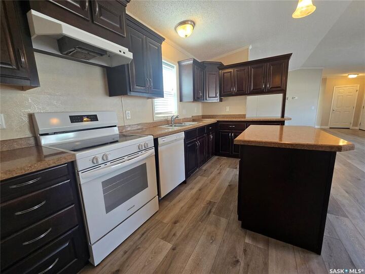Property Photo: 210 Brownlee Street SK S4H 3P4