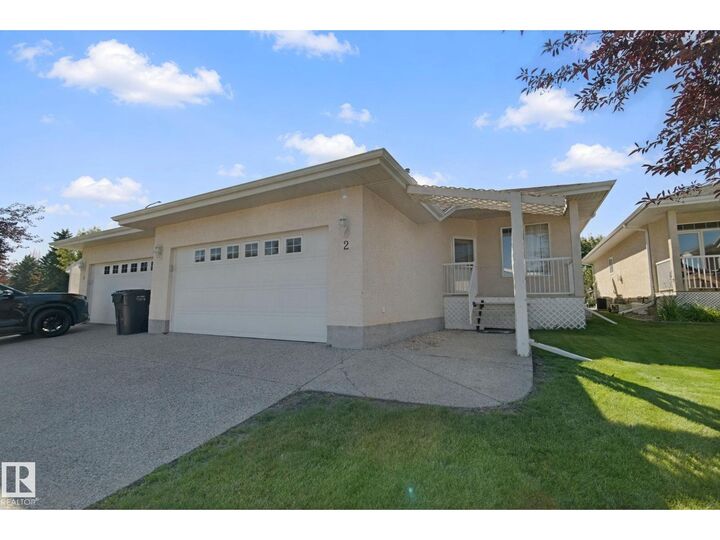 Property Photo:  #2 9 Deer Park Dr S  AB T7X 4H8 
