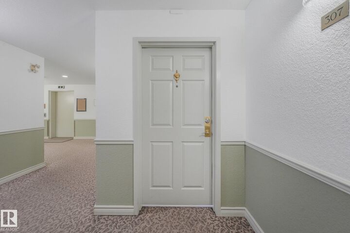 Property Photo: 10945 21 Avenue NW 307 AB T6J 6R3