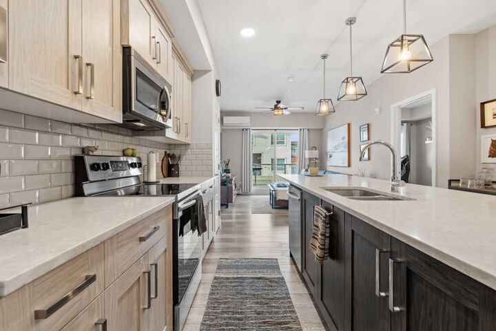 Property Photo:  370 Harvest Hills Common 205  AB T3K 2M8 