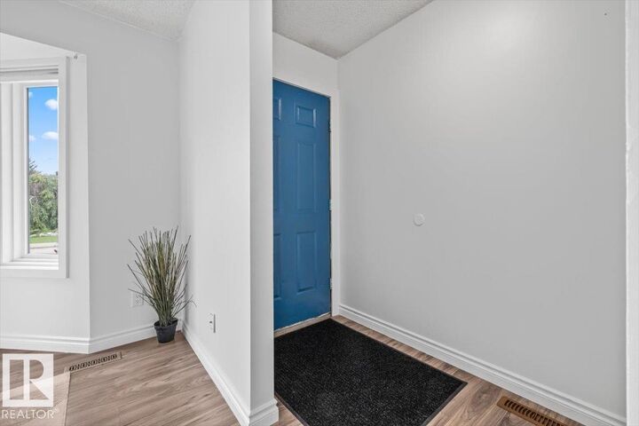 Property Photo:  18703 57 Avenue NW  AB T6M 2A6 