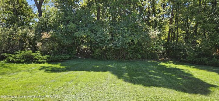 Property Photo:  1775 Mirabeau Drive  MI 48864 