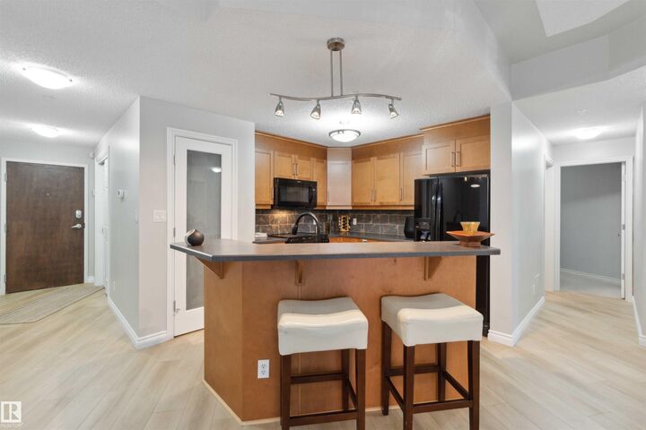 Property Photo:  9020 Jasper Avenue NW 402  AB T5H 3S8 