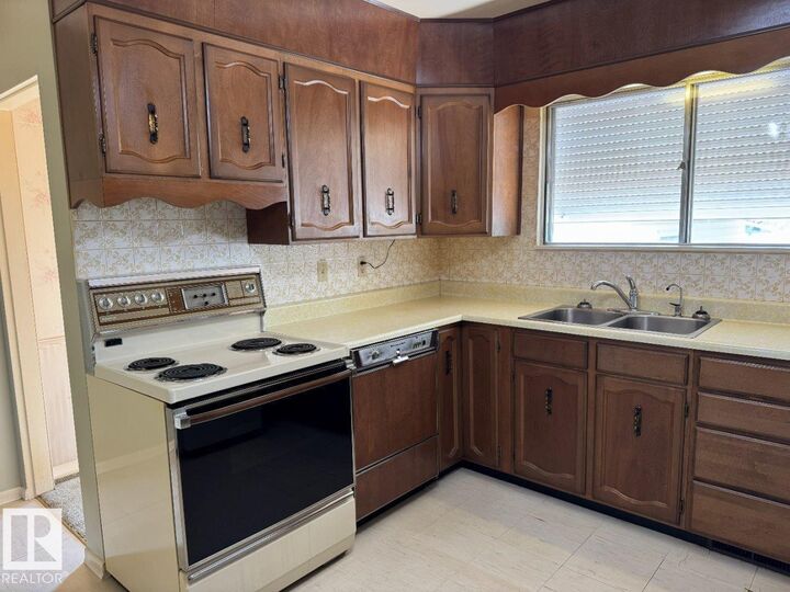 Property Photo:  9119 130 Avenue NW  AB T5E 0S1 