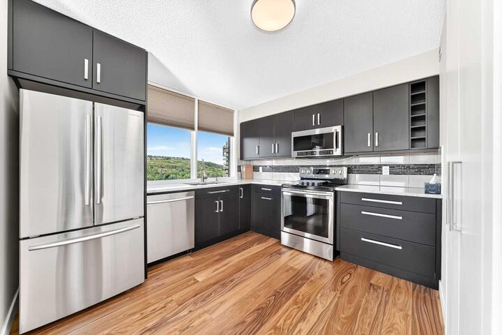 Property Photo: 145 Point Drive NW 1708 AB T3B 4W1