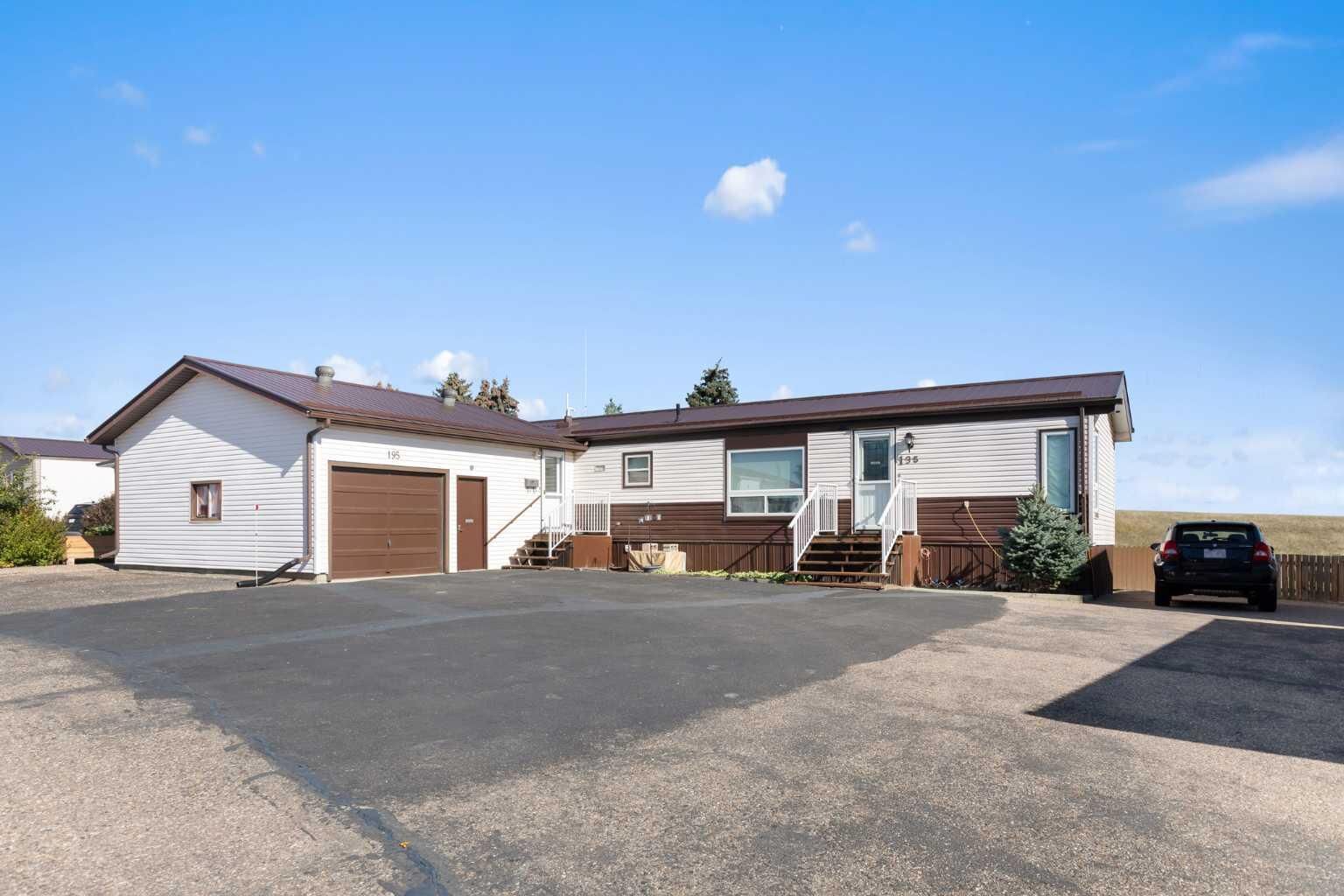Property Photo:  195 Fairchild Street SW  AB T1A 7Z6 