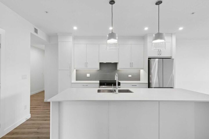 Property Photo:  1802 Mahogany Boulevard SE 6320  AB T3M 4A5 