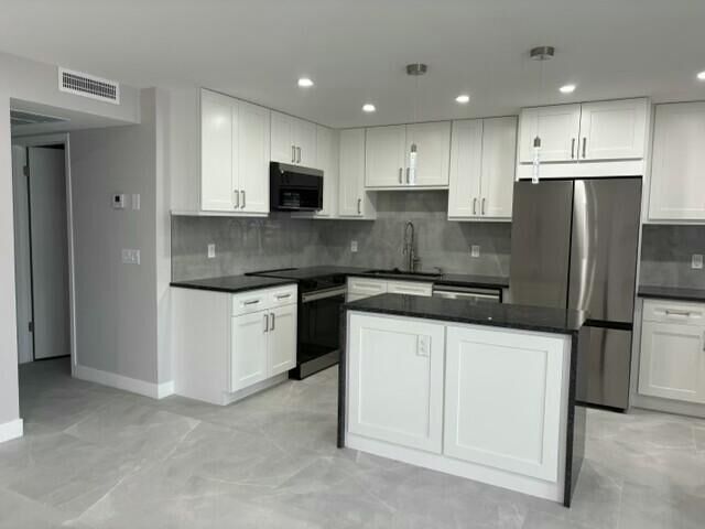 Property Photo:  1064 Exeter D  FL 33434 