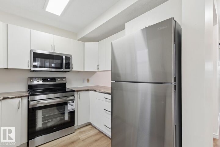 Property Photo:  10475 24 Avenue NW  AB T6J 4S2 