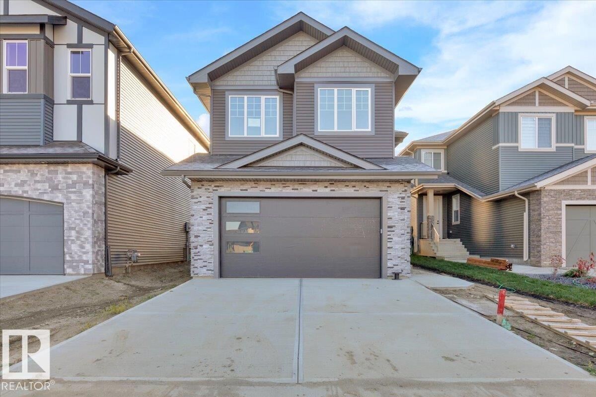 Property Photo: 1115 Gyrfalcon Crescent NW AB T5S 0S1