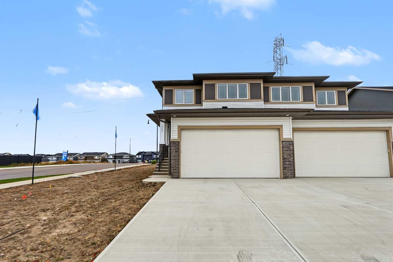 Property Photo:  303 Dawson Dock Way  AB T1X 2W4 