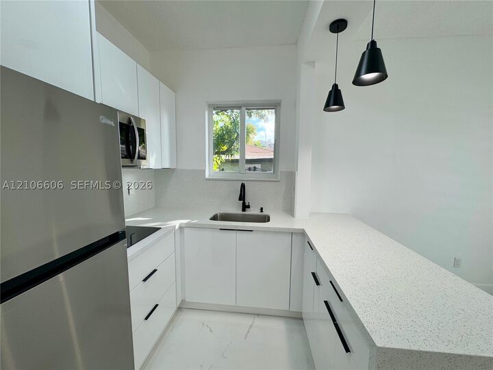 Property Photo:  421 NW 13th Ave B  FL 33125 