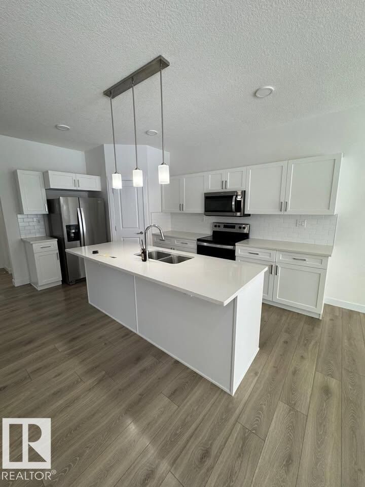 Property Photo:  938 Daniels Loop SW  AB T6W 4Y4 