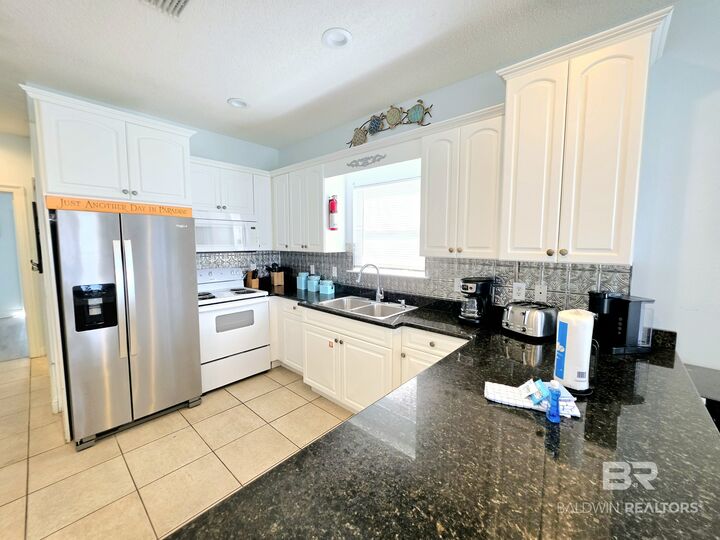 Property Photo:  1433 W Lagoon Ave B  AL 36542 