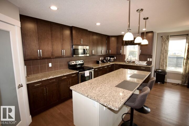 Property Photo:  7704 Ellesmere Lane  AB T8H 0P7 