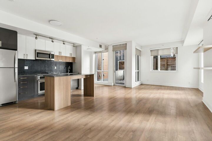Property Photo:  619 Confluence Way SE 124  AB T2G 0G1 