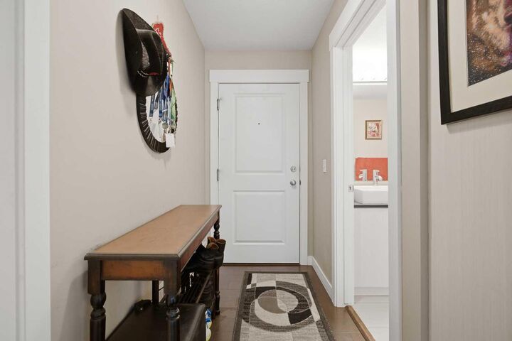 Property Photo:  11 Mahogany Row SE 3401  AB T3M 2L6 