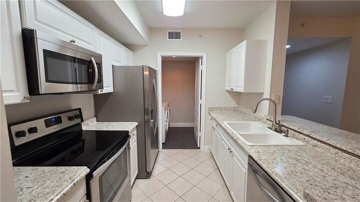 Property Photo:  5090 Fairways Circle H105  FL 32967 