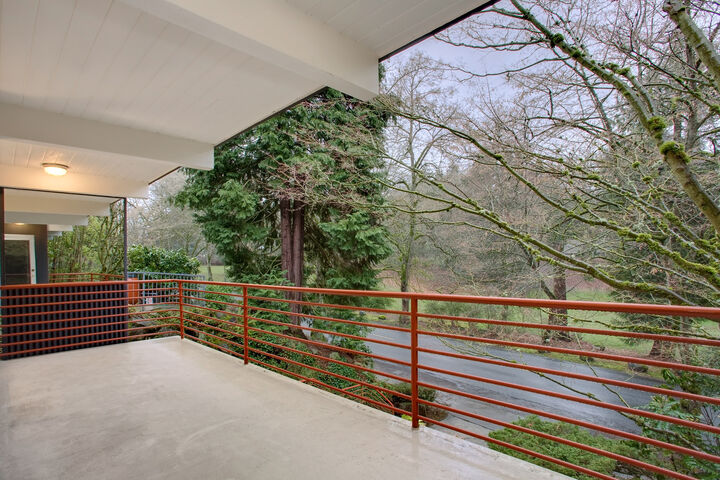 Property Photo: Large living room with expansive covered balcony 2524 Lake Park Dr S  WA 98144 